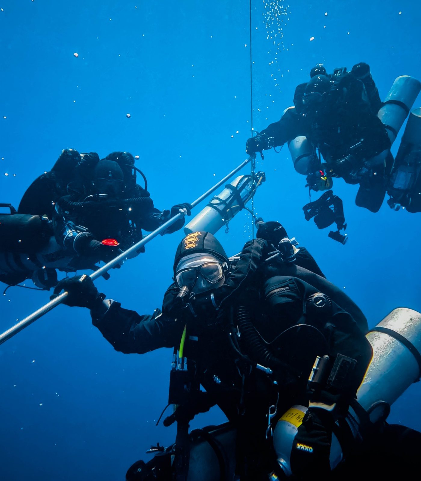 Technical divers on the deco bar in open blue water off Malta