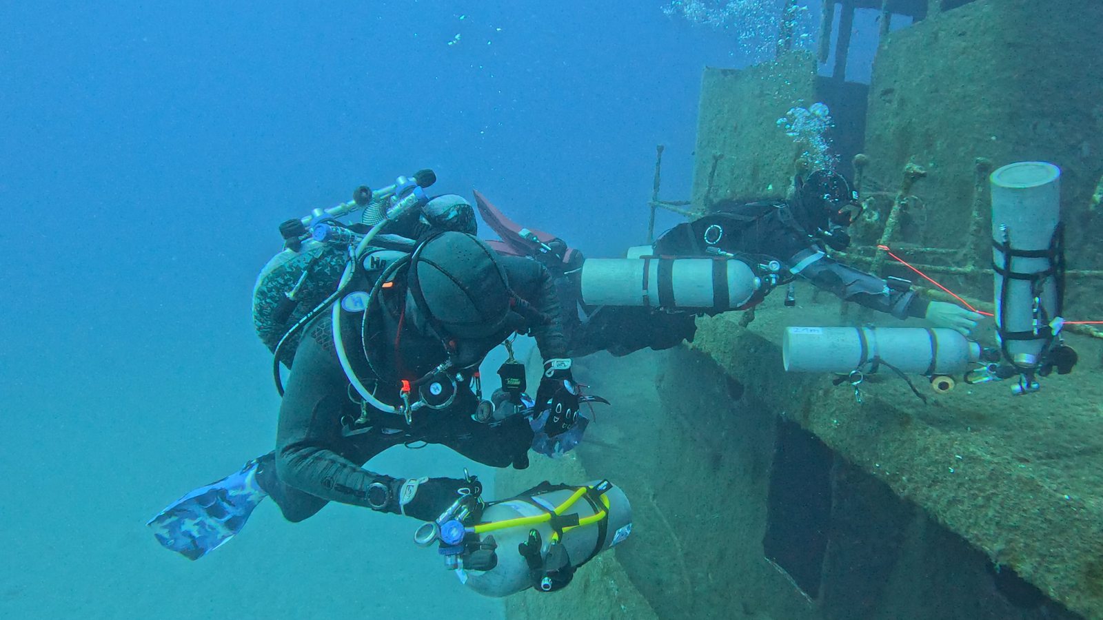 The team picking up stage cylinders on a wreck during technical training